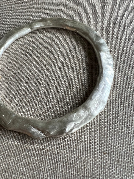 CAST SILVER - Bangle in solid sterling silver with hammered detail